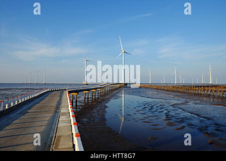 Group wind turbines of Bac Lieu wind power plant at Mekong Delta, Vietnam. Windmill at Baclieu seaside at morning, clean energy for Viet nam industry Stock Photo