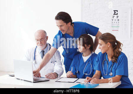 Medical doctors team using computer isolated on white Stock Photo