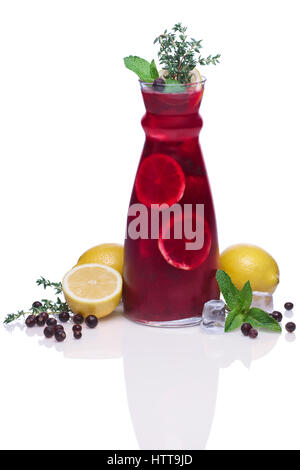 Cold drink with black currant, lemon, mint and thyme Stock Photo