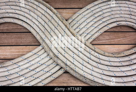 Neatly coiled rigging ropes on boat. Stock Photo
