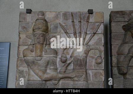 Elam. Moulded clay brick panel: God (bull-man) with palm-trees (symbols of fertiliy. Temple of Inshushinak, Susa, 2000 BCE. Louvre. Paris. Stock Photo