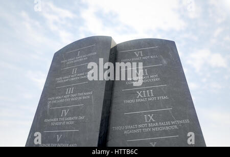 A 3D render of two stone tablets with the ten commandments etched on ...