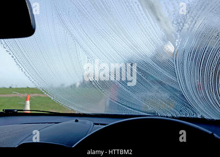 Windscreen of a car being washed Stock Photo