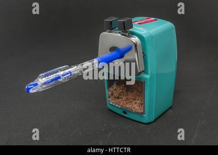 A pencil sharpener isolated with pen inside Stock Photo