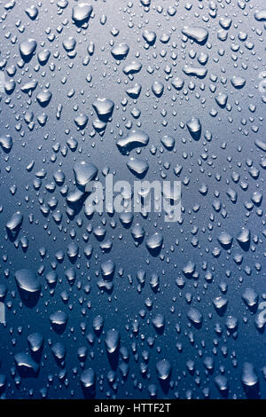 Rain drops on shiny car paintwork Stock Photo