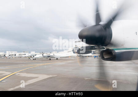 spinning propeller on an airplane with blue skies Stock Photo
