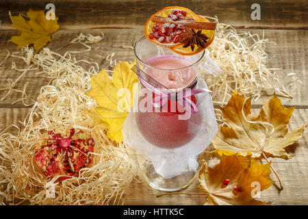 Ice tea with lemon splash. Hot yellow tea with lemon and many slices of lemon on wooden background, wooden table. Ginger tea with lemon on a wooden ta Stock Photo