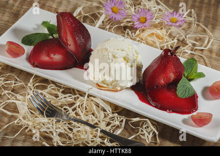 Ice cream with fruits. Raspberry ice cream in white plate overhead shot. Stock Photo