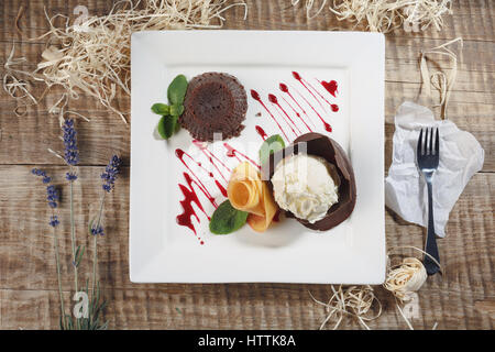 Ice cream with fruits. Raspberry ice cream in white plate overhead shot. Stock Photo