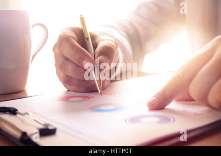 Businessman study financial report. Concept for business, finance, market research, analytics and statistics, marketing. Stock Photo