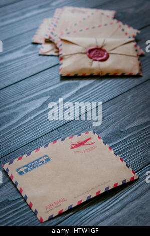 Old retro envelopes with a wax stamp on old wooden table Stock Photo