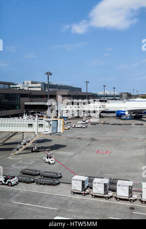 NARITA, JAPAN - CIRCA APR, 2013: Main terminal, boarding bridges and runway are in the Narita International Airport. Narita Airport is the predominant Stock Photo