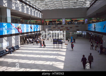 NARITA, JAPAN - CIRCA APR, 2013: Interior of large departure hall is in Narita International Airport. Passengers wait for connecting shuttle. It is th Stock Photo