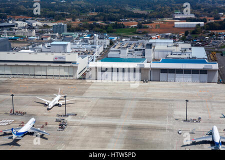 NARITA, JAPAN - CIRCA APR, 2013: Top view at runway with aircrafts of the Narita International Airport. Narita Airport is the predominant airport. It  Stock Photo