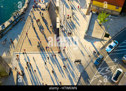 Aerial view of a people walking on the street at sunset Stock Photo