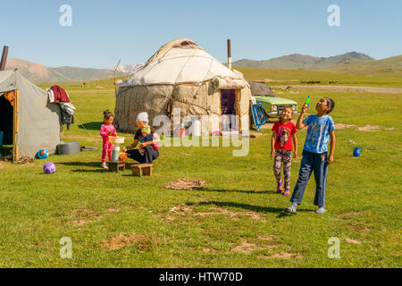 Nomad family by yurt, Kyrgyzstan Stock Photo