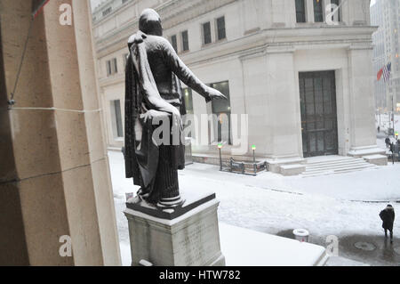 New York, USA. 14th Mar, 2017. Wall Street dawns closed due to heavy snowfall. The streets of the financial market dawn with little movement. NYC public schools closed today, above-ground subway service canceled due to heavy snowstorm this morning. Credit: Luiz Roberto Lima/Pacific Press/Alamy Live News Stock Photo