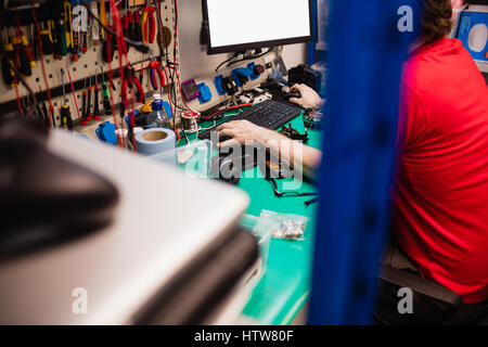 Man working on desktop pc Stock Photo