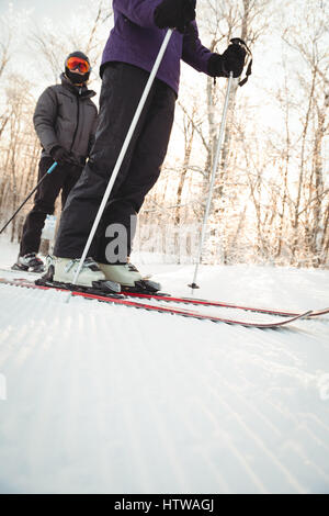 Skier skiing on snowy landscape in ski resort Stock Photo