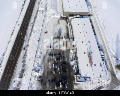 NUIJAMMAA, FINLAND - CIRCA FEB, 2017: Top view at Laplandia market warehouse and asphalt road. Finland’s store is located on Russian-Finnish border. T Stock Photo