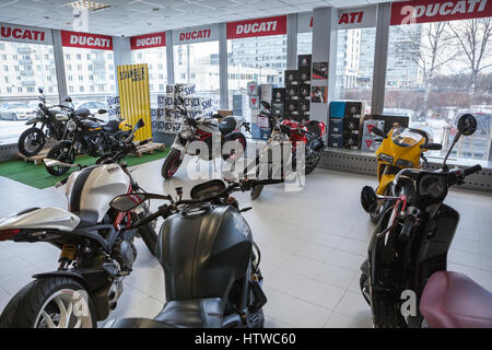 ST. PETERSBURG, RUSSIA - CIRCA FEB, 2017: New street and scrambler motorcycles of Ducati brand are on sale in motorcycle store. Official dealership of Stock Photo