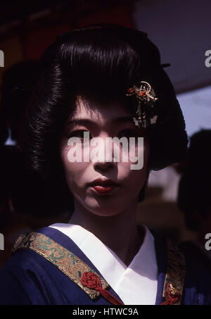 Geisha in Asakusa district of Tokyo, Japan.  The word consists of two kanji characters, (gei) meaning 'art' and (sha) meaning 'person' or 'doer'. The Stock Photo