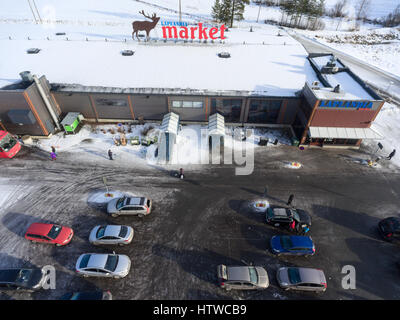NUIJAMMAA, FINLAND - CIRCA FEB, 2017: Entrance of Laplandia market is at winter season. Aerial view. Cheapest store by Atma trade OY is located on Rus Stock Photo