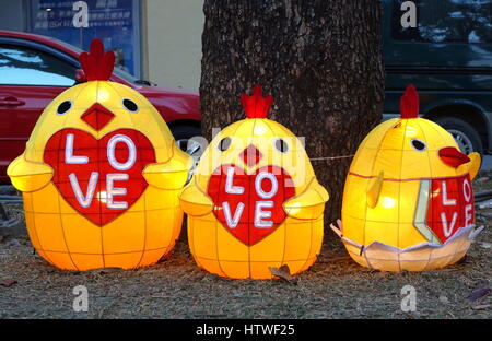 KAOHSIUNG, TAIWAN -- FEBRUARY 3, 2017: Colorful lanterns in the shape of baby chicks are on display along the banks of the Love River during the tradi Stock Photo