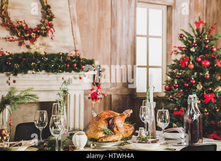 Delicious roasted turkey on served holiday table decorated for Christmas Stock Photo