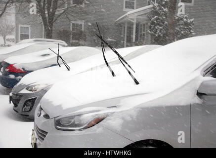 Windshield wipers on a car during a snow storm Stock Photo