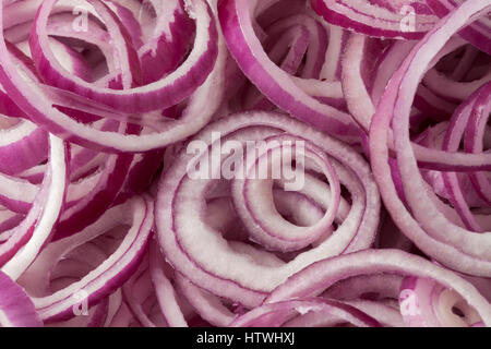 Fresh raw red onion rings full frame close up Stock Photo