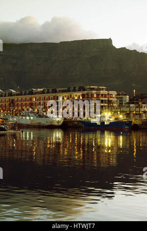 Cape Town Waterfront, Table Mountain and the Cape Grace Hotel at dusk, Cape Town South Africa Stock Photo