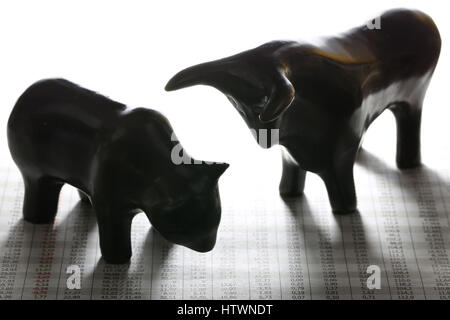 bull and bear at newspaper with stock quotes Stock Photo