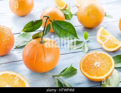 Ripe oranges on the white wooden table. Stock Photo