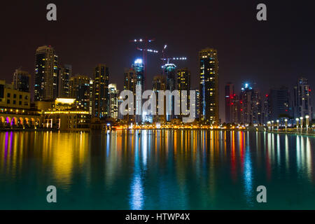 Skyscrapers and Burj Khalifa lake at night. Dubai city.  Dubai. United Arab Emirates. Stock Photo