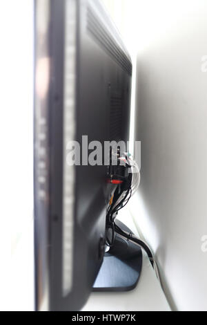 Various cables in the back of a LCD TV Stock Photo