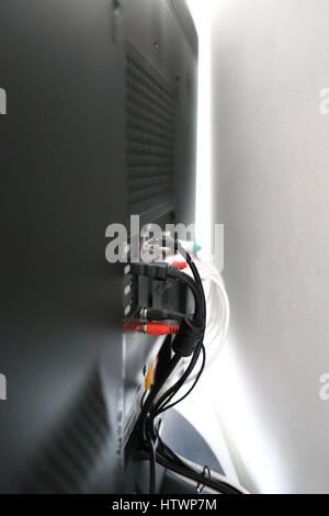 Various cables in the back of a LCD TV Stock Photo