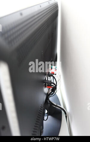 Various cables in the back of a LCD TV Stock Photo