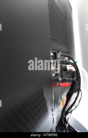 Various cables in the back of a LCD TV Stock Photo