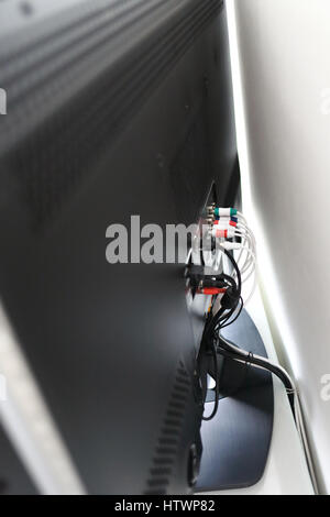 Various cables in the back of a LCD TV Stock Photo