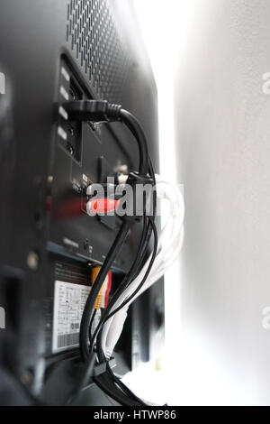 Various cables in the back of a LCD TV Stock Photo