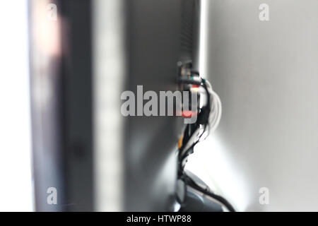 Various cables in the back of a LCD TV Stock Photo