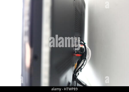 Various cables in the back of a LCD TV Stock Photo