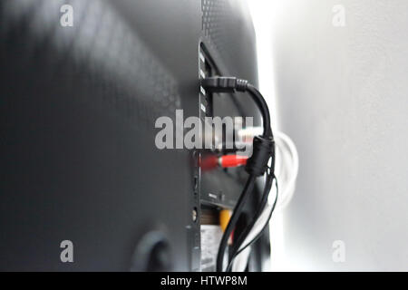 Various cables in the back of a LCD TV Stock Photo