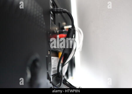 Various cables in the back of a LCD TV Stock Photo