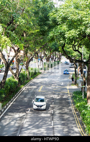 Tree lined dual carriageway Beach Road Singapore. Stock Photo