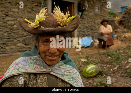 Elderly woman chews coca leaves, high in the Peruvian Andes,Peru, South America. Stock Photo