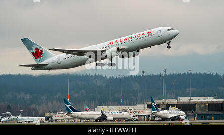 Air Canada Westjet Airlines planes plane airplanes airplane Vancouver International Airport Canadian airline industry company competition Stock Photo