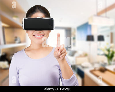 asian woman wearing 3d rendering vr headset Stock Photo