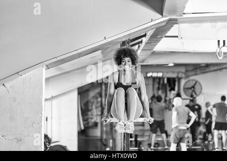 african american athlete woman workout out arms on dips horizontal